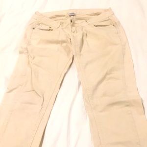 Beige pants with rhinestones on pockets